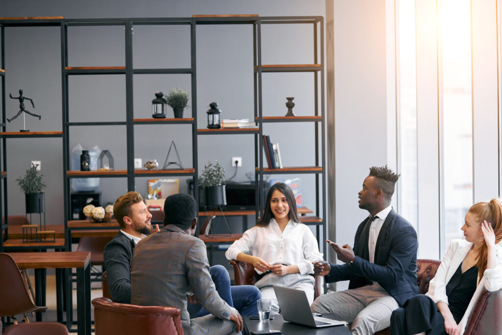 Happy business partners together in modern office